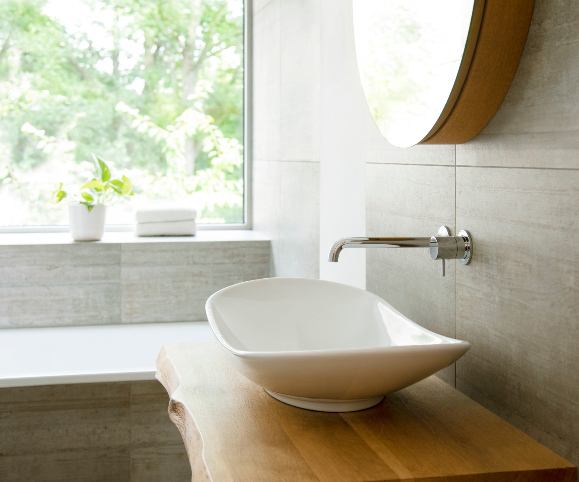 View from a bathroom over the sink to the window outside